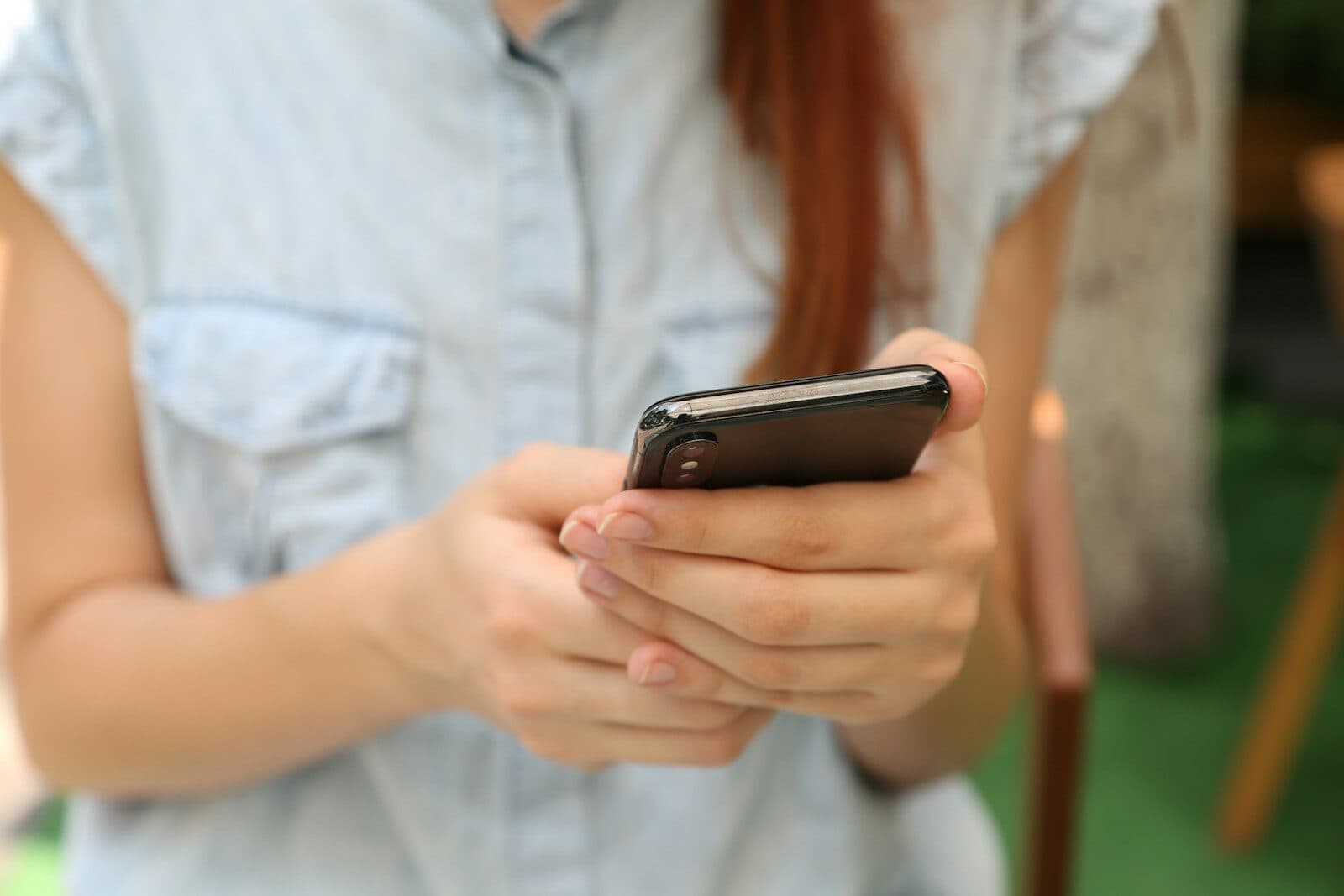 A person reading on a smartphone